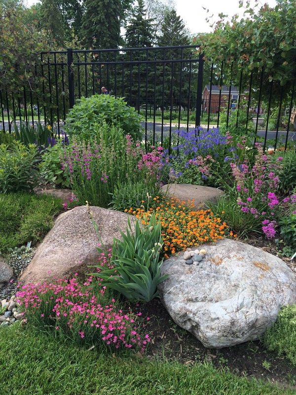 Mix-large-rocks-with-flowers-in-beds.